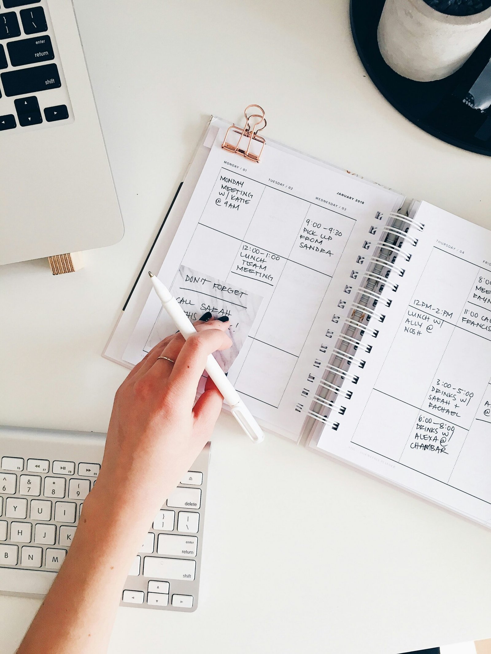 the image shows someone writing a key date into their diary